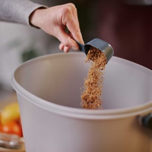 Sprinkle-bokashi-bran-on-the-bottom-of-Bokashi-Organko-Essential image-web
